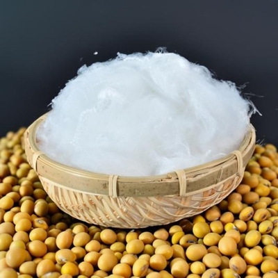 Low Melt Polyester Staple Fiber for Enhanced Bonding in Nonwoven Applications